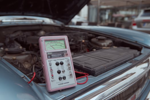 A pink car with a multimeter photo
