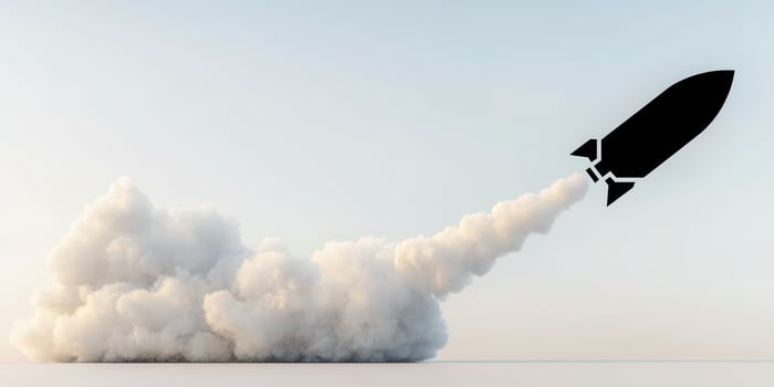 rocket silhouette ascends with smoke trail, symbolizing innovation and exploration photo