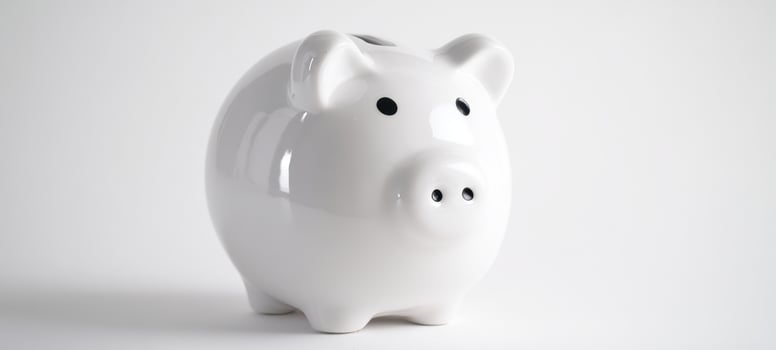 The white ceramic piggy bank for modern saving and budgeting strategies. photo