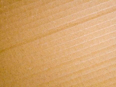 Brown cardboard textured background with diagonal lines and natural surface detail photo