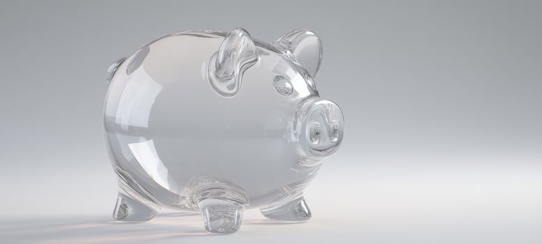 The transparent glass piggy bank reflecting saving and investment concepts. photo
