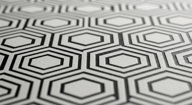 A close up of a black and white patterned wall photo