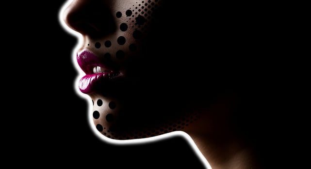 A woman with a black background and pink lips photo