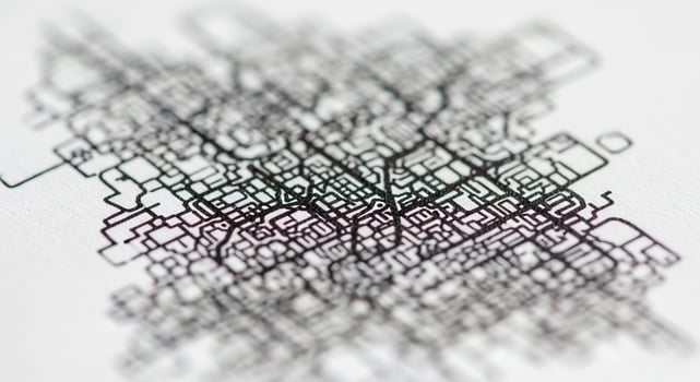 A close up of a black and white drawing of a city photo