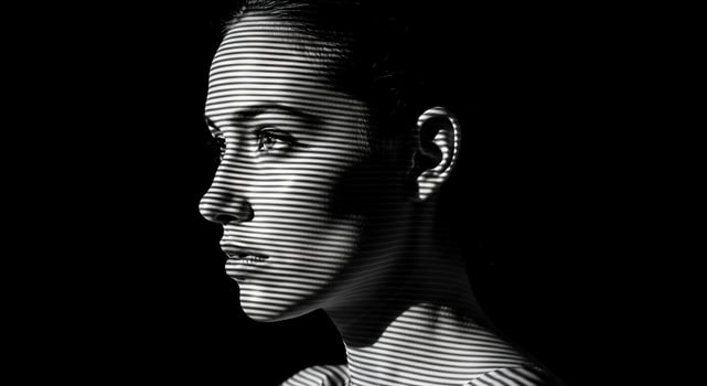 A woman with a black background and a white line photo