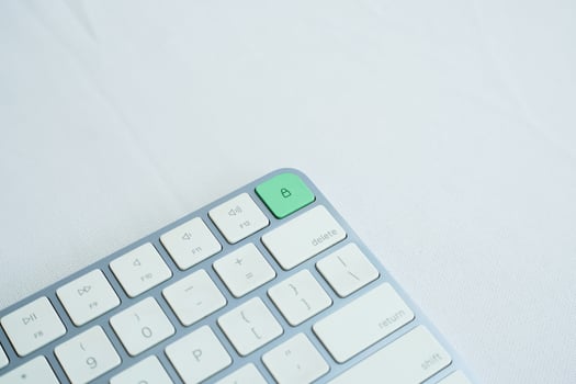 the lock icon on the keyboard is highlighted in green. security concept photo