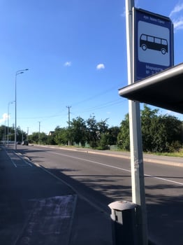 Quiet bus stop on a sunny day in a rural area photo