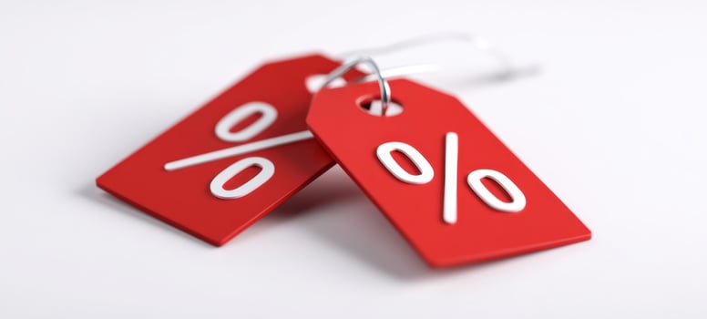 The vibrant red discount tags showcasing percentage symbols for sales promotions. photo