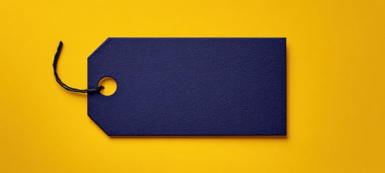 The blue tag on a vibrant yellow background for creative designs. photo