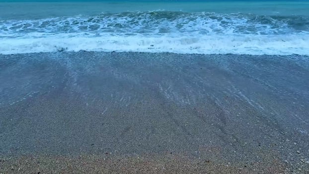 Experience the Serene Beach Waves at Dusk A Truly Relaxing and Beautiful Ocean View photo