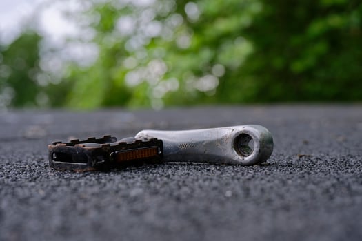 A Bicycle Pedal on Asphalt photo