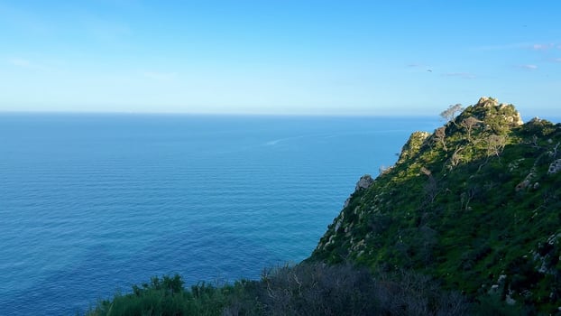 Breathtaking Scenic Ocean View from a Majestic Rocky Cliff Overlooking the Atlantic Ocean photo