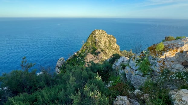 Captivating Scenic Coastal View Featuring Majestic Rock Formation Against the Ocean Horizon photo