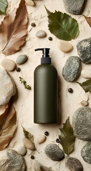 Dark Green Pump Bottle Surrounded by Rocks and Leaves photo