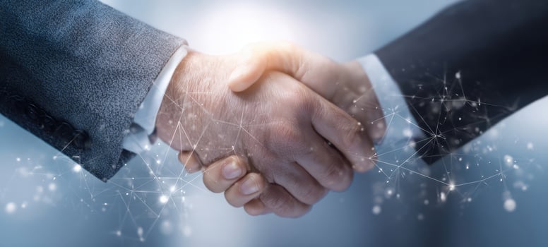 The close-up of a handshake symbolizing partnership and collaboration in business. photo
