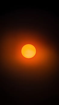 Fiery Orb Shines Brightly Amidst Darkness. photo