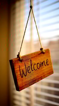 Warm Welcome Hanging Wooden Sign with Sunlight Glow. photo