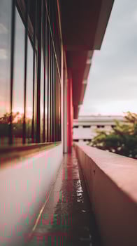Reflective Sunset on Wet Balcony Creating a Calm and Serene Mood. photo