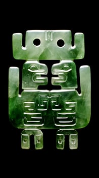 Ancient Jade Pendant with Mythical Creature Design on Black Background. photo