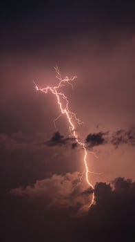 Powerful Thunderstorm Strikes with Bright Lightning in Dark Skies. photo