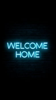 Bright Blue Neon Welcome Home Sign on Dark Brick Wall. photo