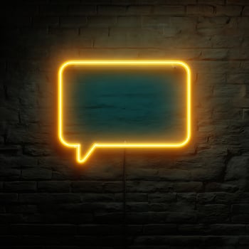 Bright Yellow Neon Speech Bubble Glowing Against A Dark Brick Wall. photo