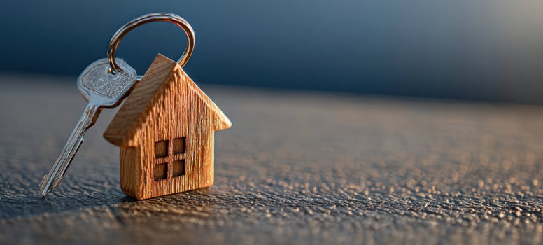 The wooden house key symbolizing new beginnings and home ownership. photo