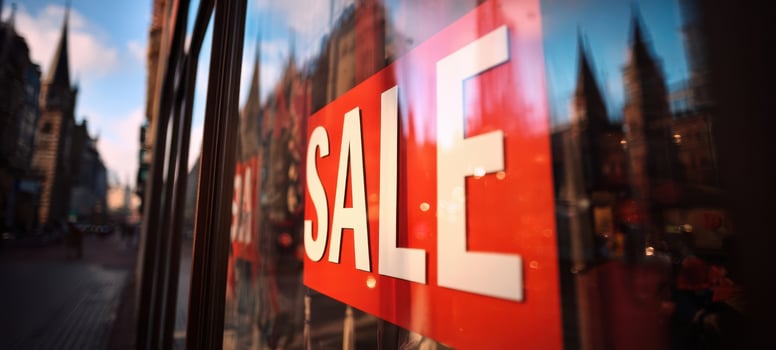 The vibrant sale sign reflecting the bustling cityscape in a vibrant urban setting. photo
