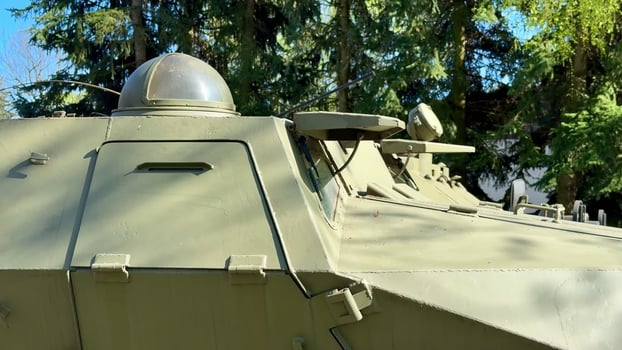 A detailed closeup view of a military vehicle showcasing its turret and various armament features photo