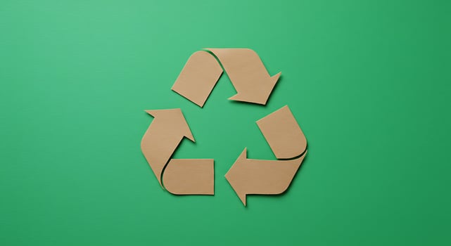Recycle symbol on green background photo