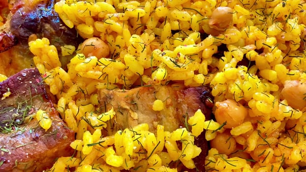 Enjoy a flavorful Yellow Rice Dish with meat and chickpeas, perfect for any meal photo