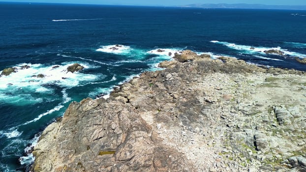 Stunning Aerial Views Showcasing Dramatic Rocky Coastlines and Beautiful Turquoise Ocean Waters photo