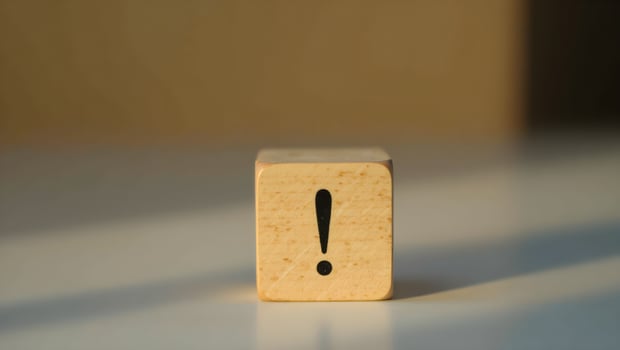 Wooden Block with Exclamation Point and Dramatic Lighting photo