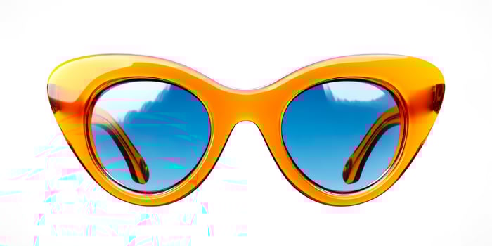 Trendy Orange Cat-Eye Sunglasses With Blue Lenses On White Background For Summer Fashion Visuals, Stylish Accessory Concepts, Vacation Lifestyle Trends, And Modern Eyewear Branding photo