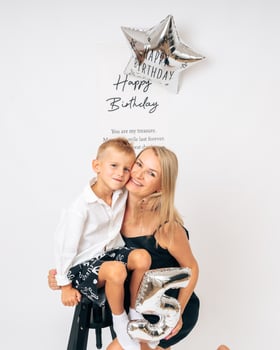 Mother and Son Celebrate 5th Birthday with Balloons photo