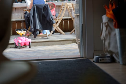Outdoor Patio with Toy Car and Diners photo