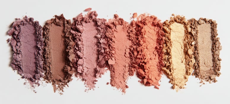 The vibrant collection of colorful cosmetic powders arranged stylishly. photo