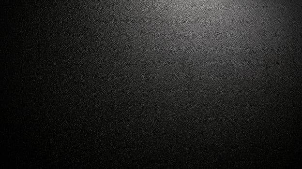 Textured black surface with subtle light reflections creating an elegant and modern background for design projects or displays photo