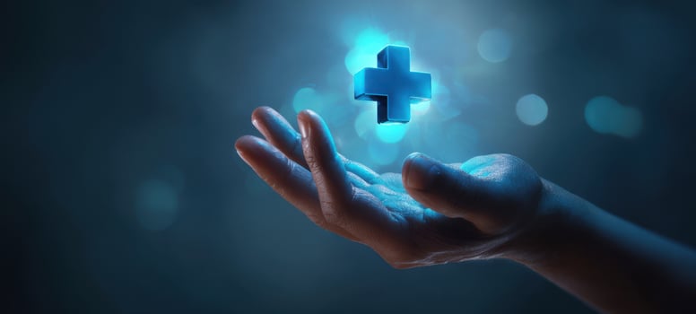 The hand supporting a glowing medical cross symbol in the air photo