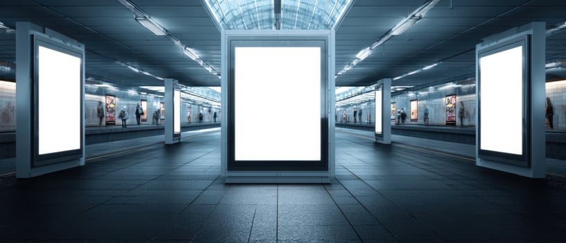 The empty subway station featuring digital advertising displays and modern architecture. photo