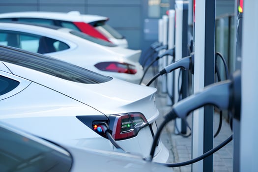 Multiple ev cars plugged into high-speed charging hub, clean energy transportation concept photo