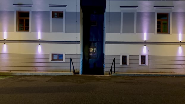 A Striking Urban Night Scene Featuring Dramatic Lighting and Remarkable Architectural Features photo