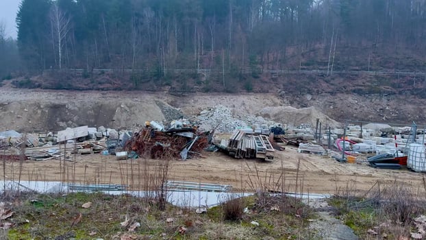 Abandoned Construction Site with Old Vehicles and Debris, highlighting neglect and disrepair photo