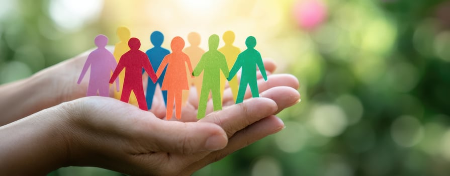 The colorful paper figures representing unity and support in a nurturing environment. photo