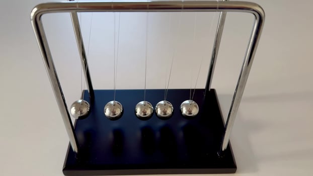 Newtons Cradle A Truly Fascinating and Engaging Physics Demonstration that Captures Attention photo