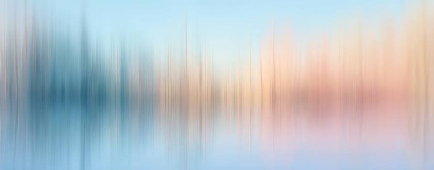 The serene reflection of colorful trees on calm water at dawn. photo