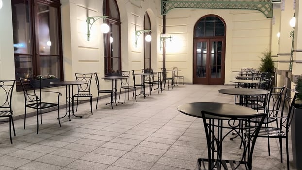 Enjoy the charming atmosphere of a delightful outdoor cafe during enchanting nighttime photo