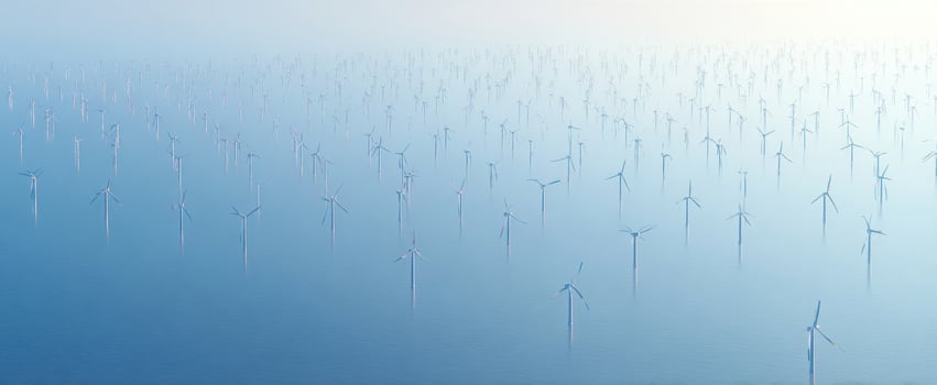 The Wind Turbines Standing Tall in an Ocean of Misty Serenity photo