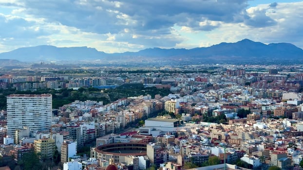 A Stunning Aerial View of a Vibrant and Colorful Cityscape Surrounded by Majestic Mountains photo