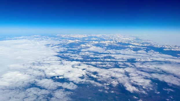 Stunning and breathtaking aerial view showcasing the majestic clouds alongside blue skies photo